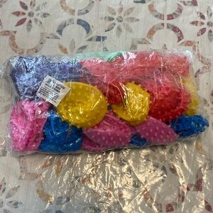 New 24 count deflated spike balls, 5”